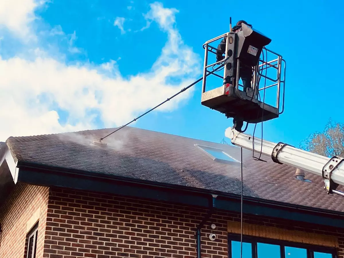 cherry-picker-steam-cleaning-roof