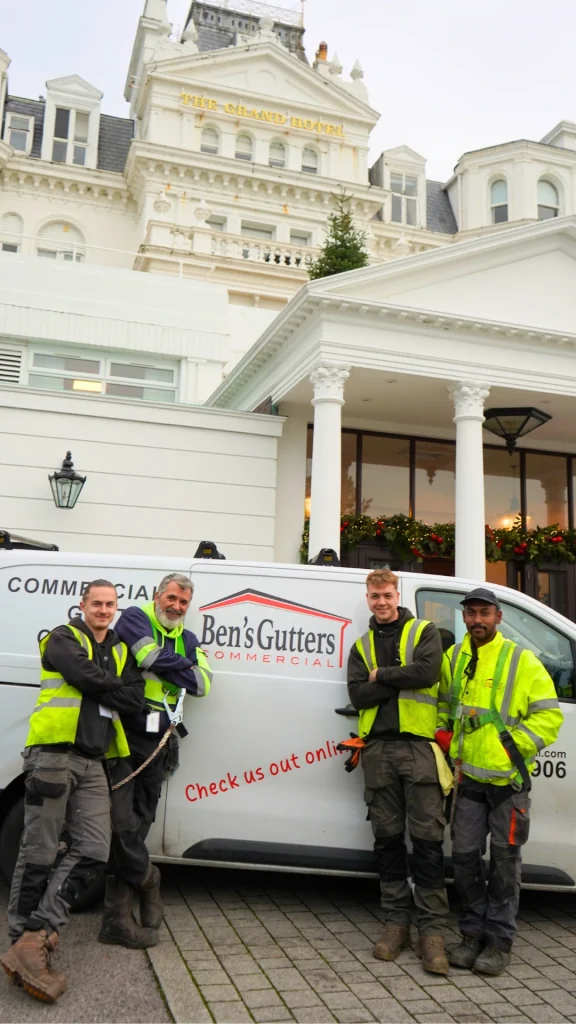 team of Ben's Gutters Commercial cleaners outside grand eastbourne hotel