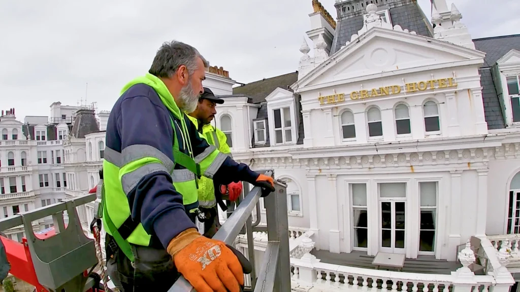 Ben's Gutters commercial cleaners up on a cherry picker cleaning a commercial property
