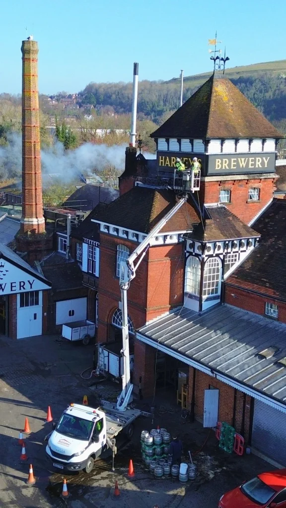 external gutter cleaning on a commercial property with cherry picker