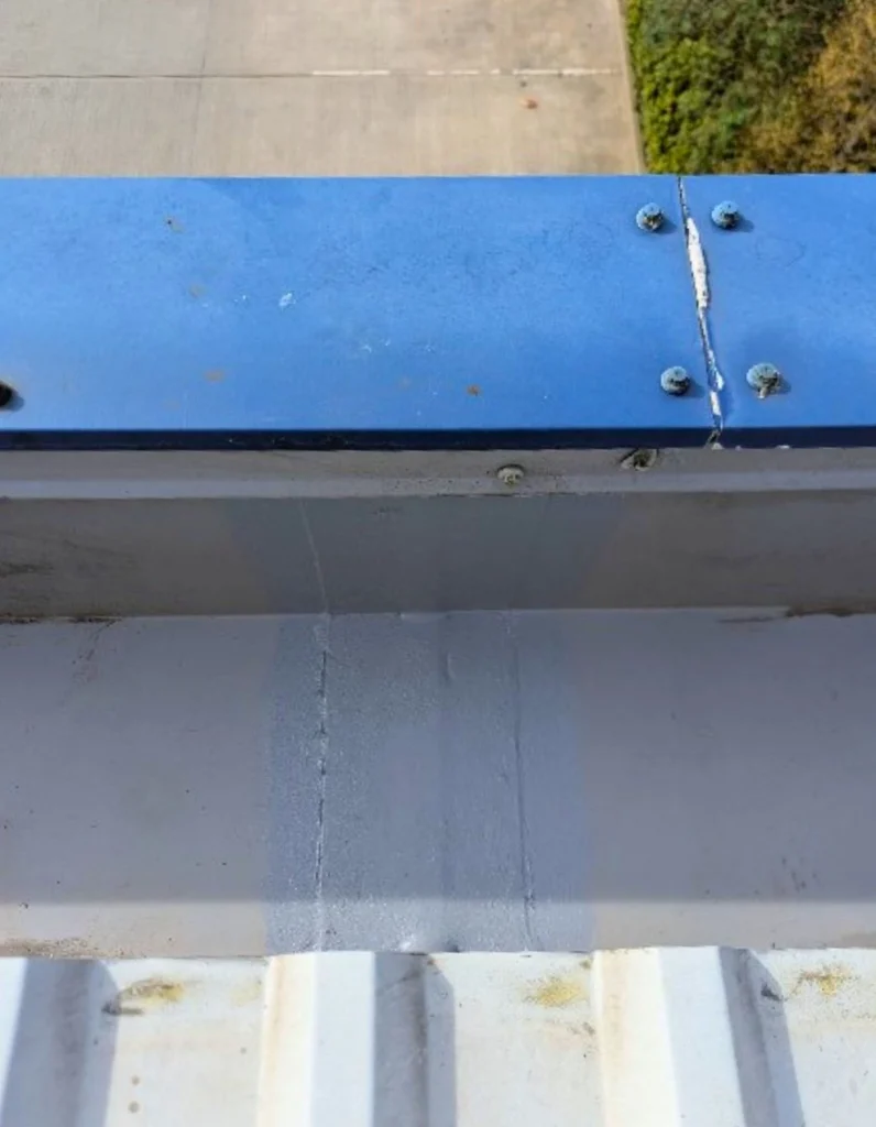 Sealant applied by technicians to commercial gutter joints